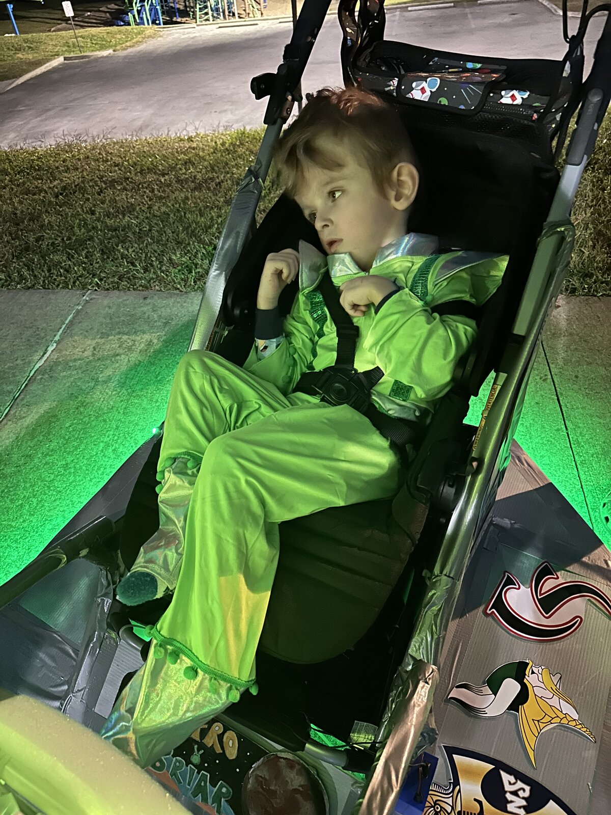 Child in an Alien costume on wheels