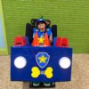 Child in a Chase from Paw Patrol costume on wheels