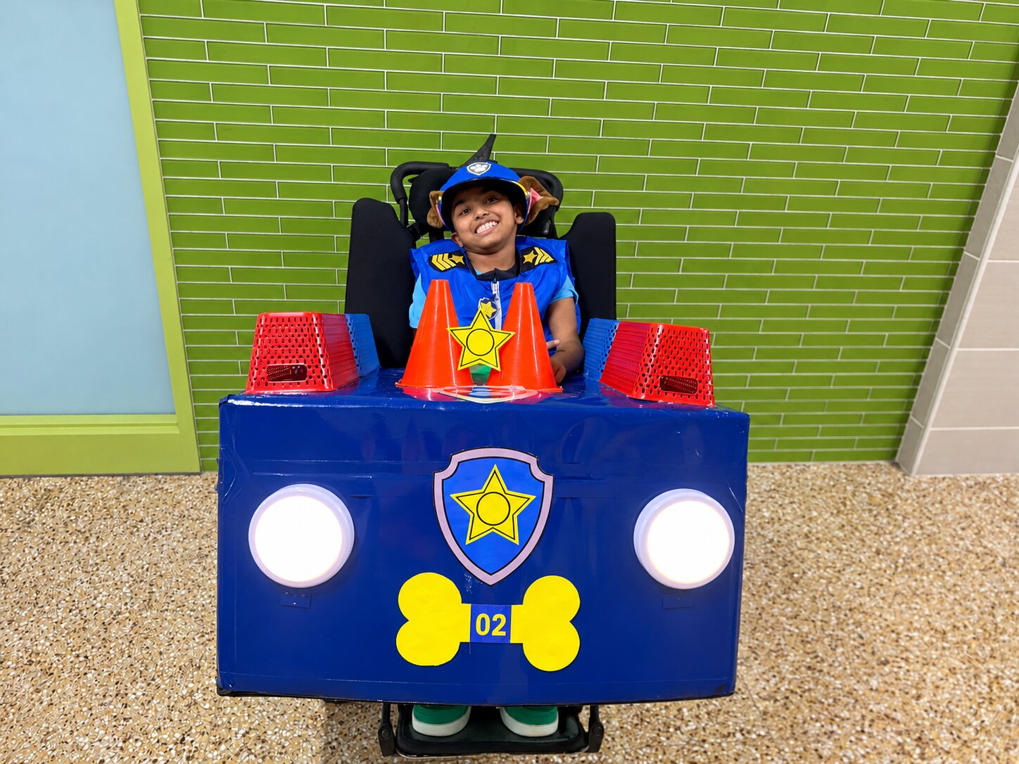 Child in a Chase from Paw Patrol costume on wheels