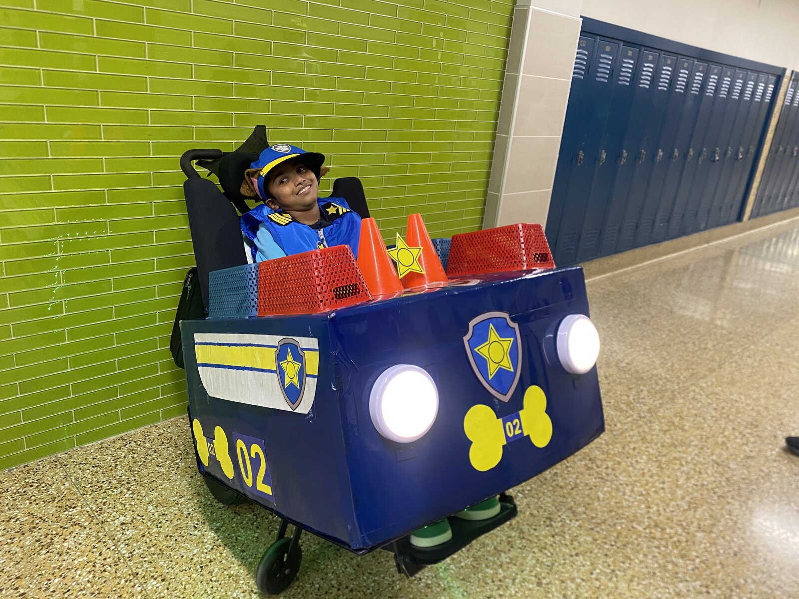 Child in a Chase from Paw Patrol costume on wheels