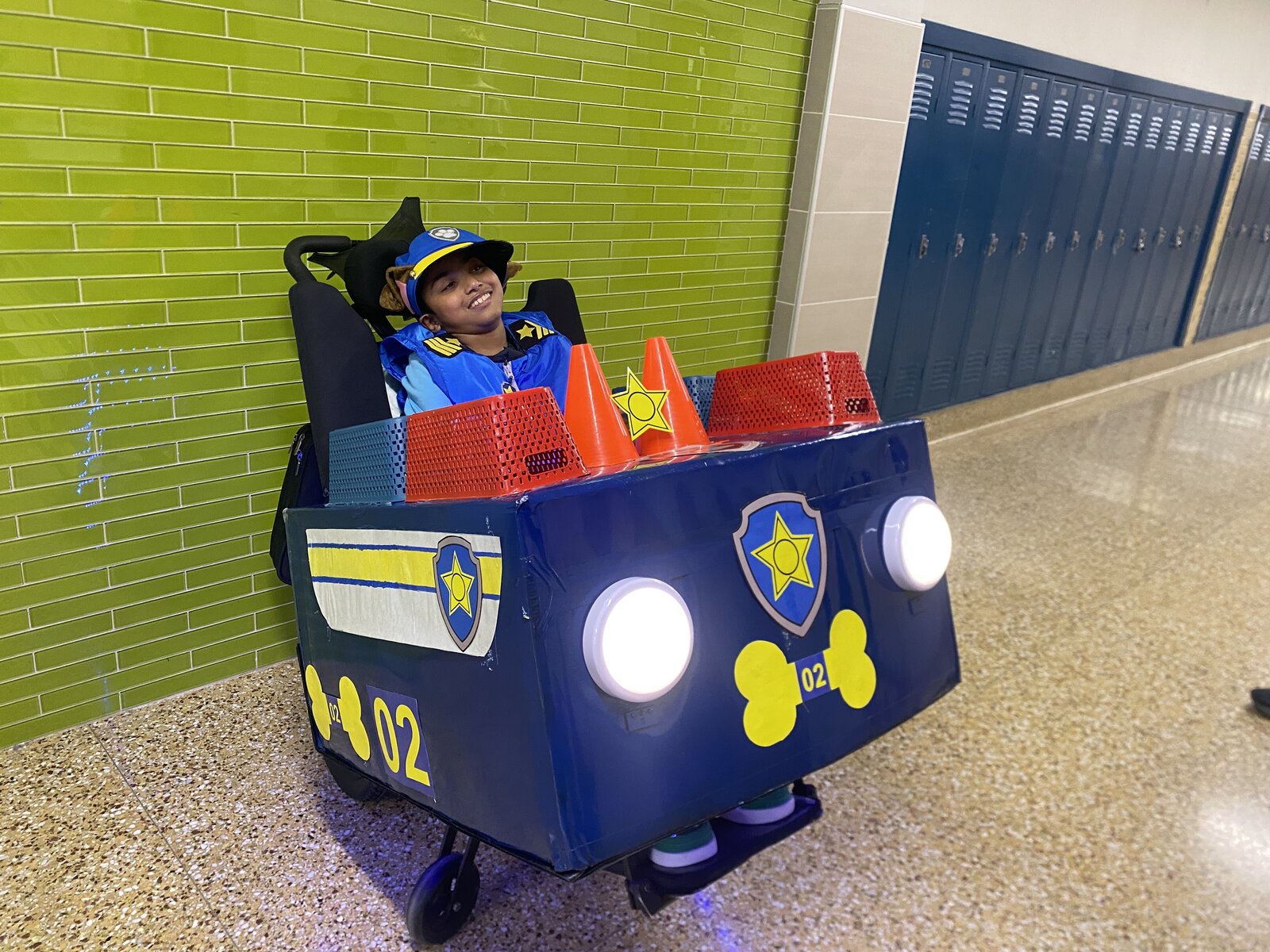 Child in a Chase from Paw Patrol costume on wheels