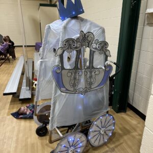 Cinderella's Carriage costume on wheels with a crown and light-up wheels
