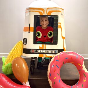Child in a Cloudy with a Chance of Meatballs costume on wheels