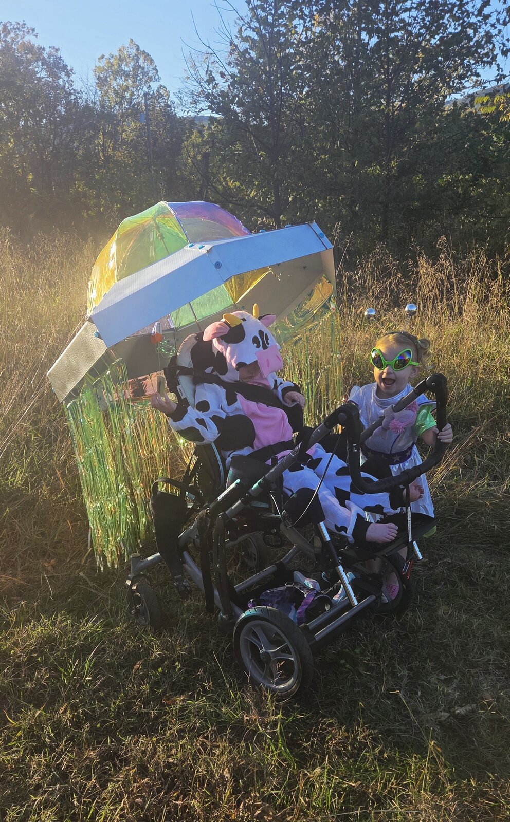 Child in a Cow Abducted by Aliens costume on wheels