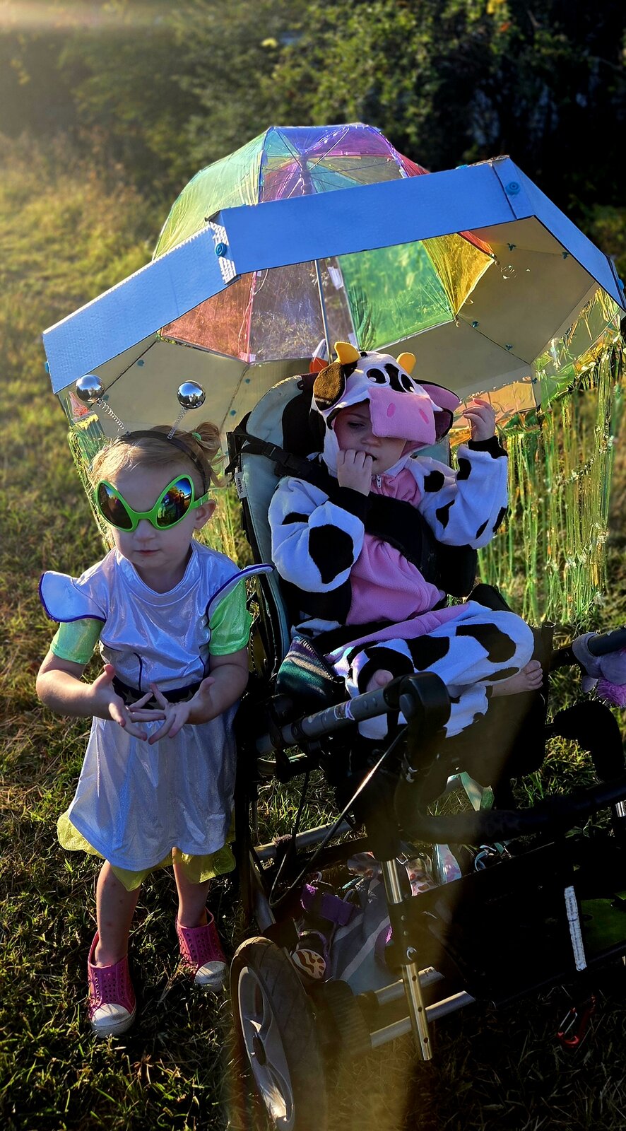 Child in a Cow Abducted by Aliens costume on wheels