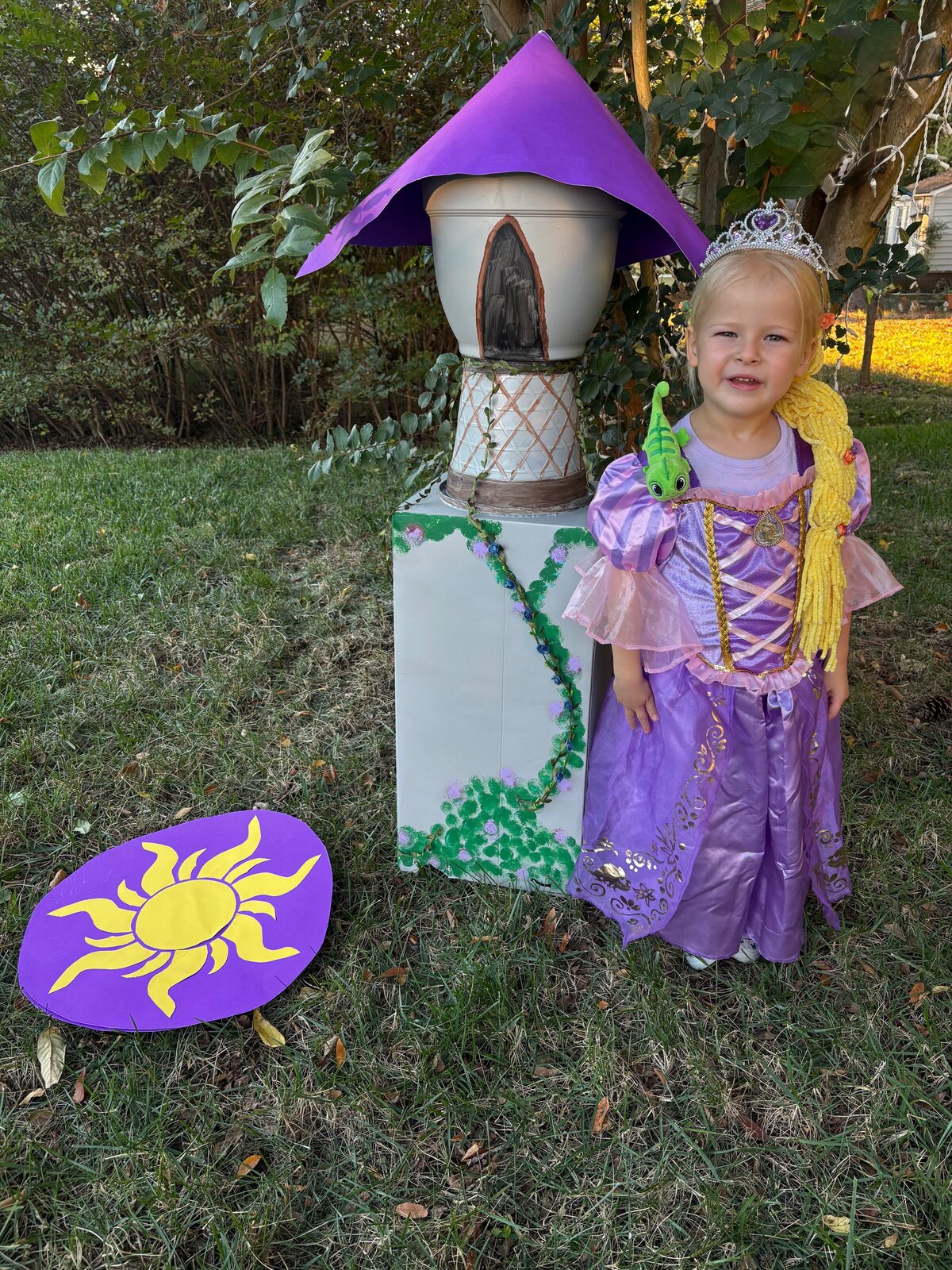 Child in a Rapunzel costume beside the Rapunzel Tower