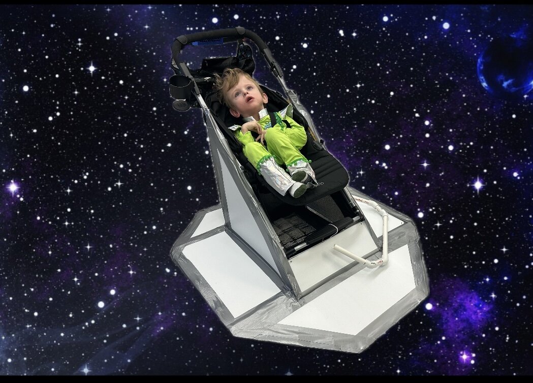 Child in an Alien costume on wheels