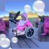 Child in a Baby Shark costume on wheels