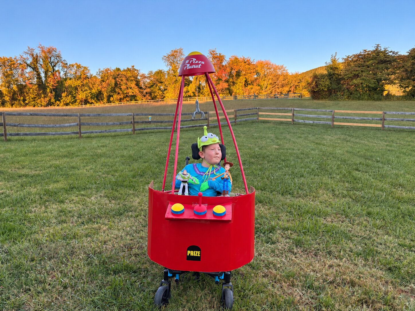 Child in a Claw Machine costume on wheels