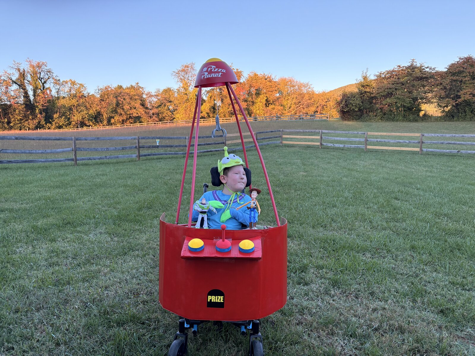 Child in a Claw Machine costume on wheels