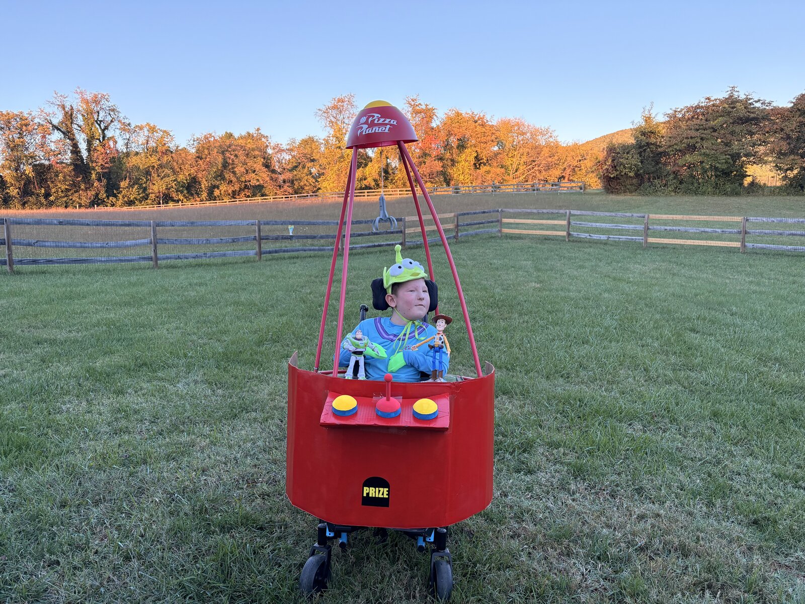 Child in a Claw Machine costume on wheels