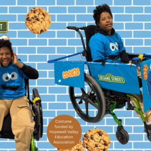 Child in a Cookie Monster costume on wheels