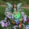 Child in a Fairy in a Leaf costume on wheels