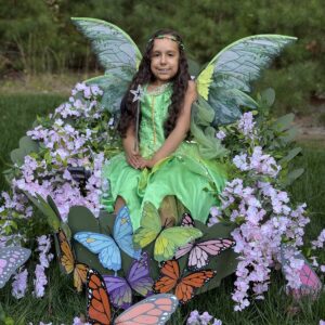 Child in a Fairy in a Leaf costume on wheels