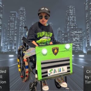 Child in a Lamborghini costume on wheels