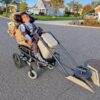 Child in a Mandalorian and Grogu costume on wheels
