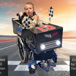 Child in a Race Car costume on wheels