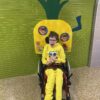 Child in a SpongeBob costume on wheels