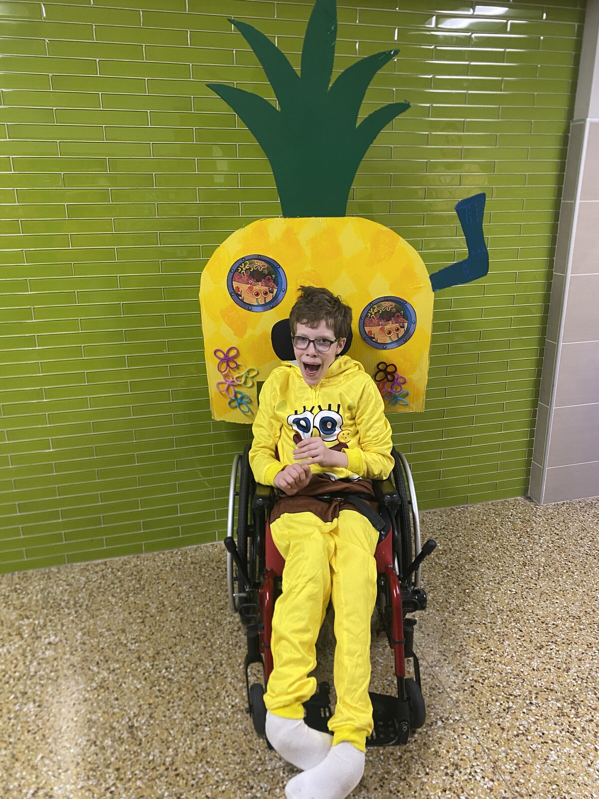 Child in a SpongeBob costume on wheels