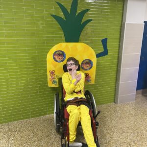 Child in a SpongeBob costume on wheels