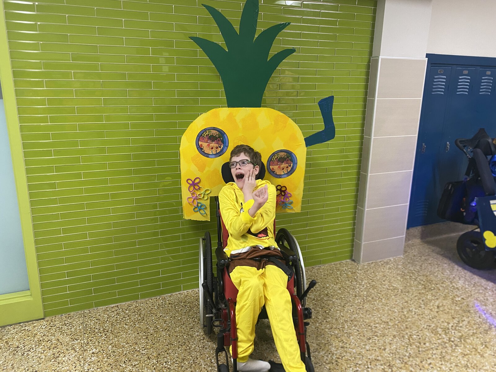 Child in a SpongeBob costume on wheels