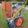 Child in a Zombie costume on wheels
