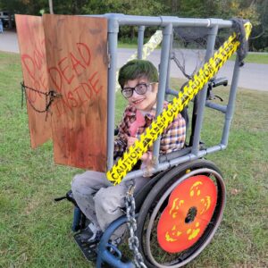 Child in a Zombie costume on wheels