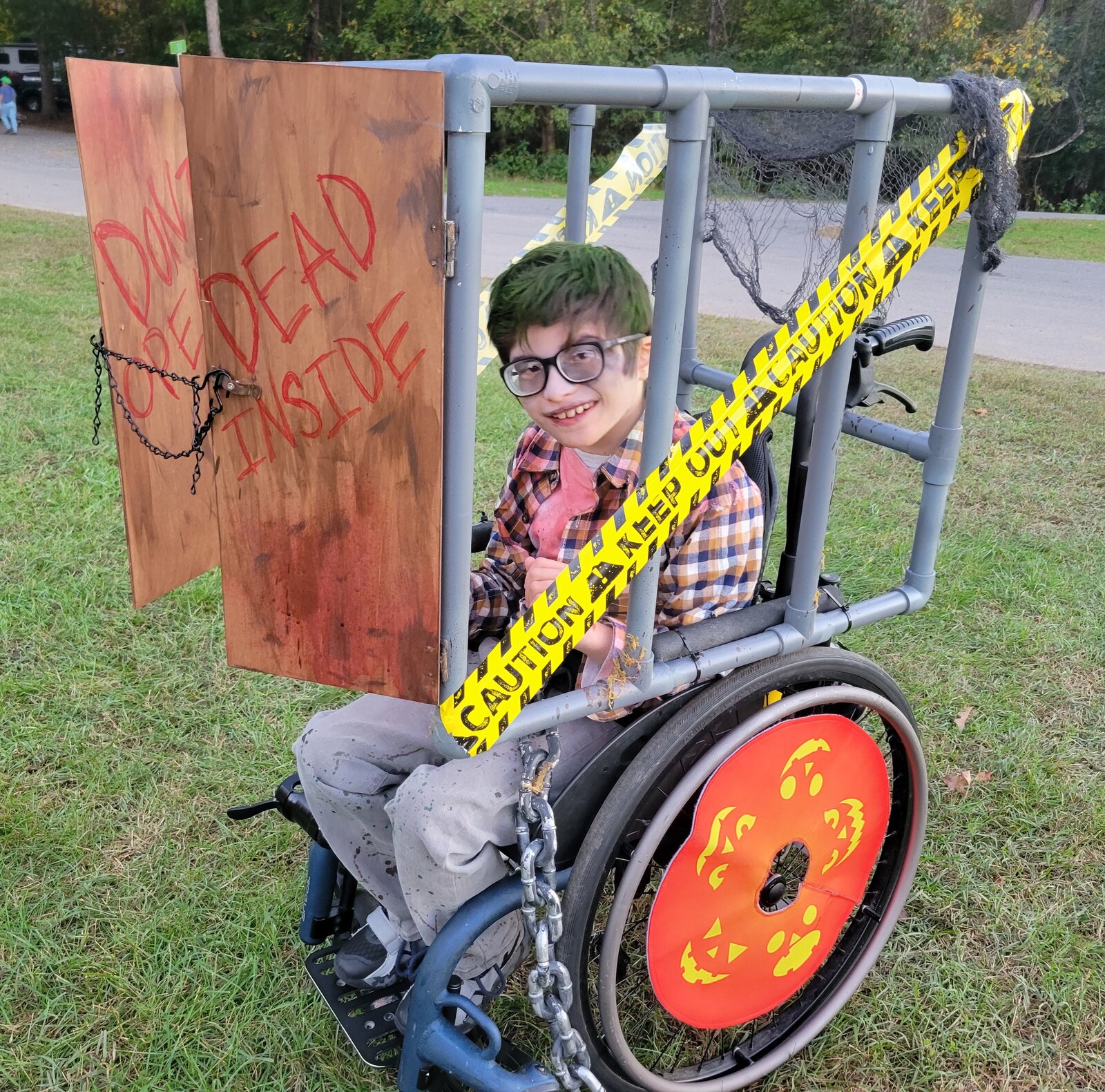 Child in a Zombie costume on wheels