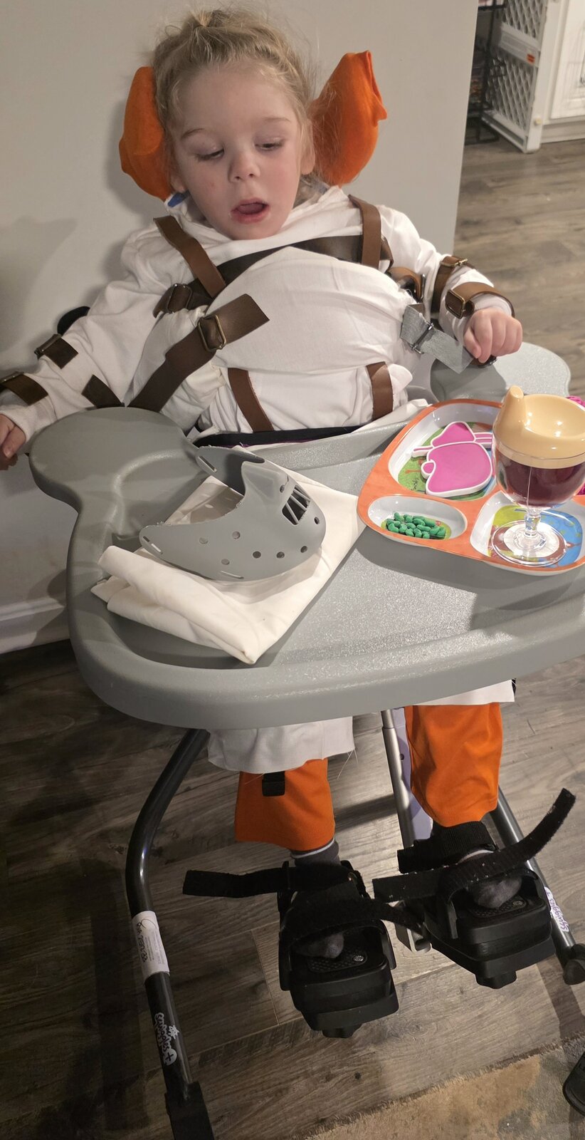 Child in a Hannibal Lecter costume on wheels