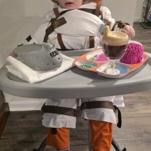 Child in a Hannibal Lecter costume on wheels