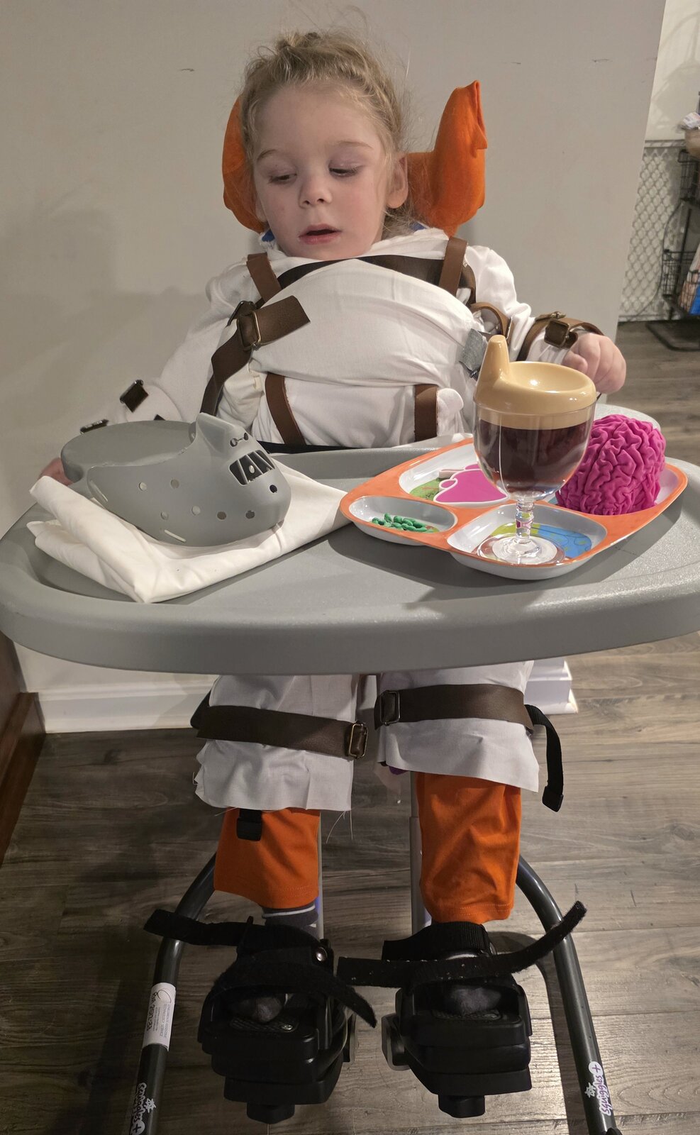 Child in a Hannibal Lecter costume on wheels