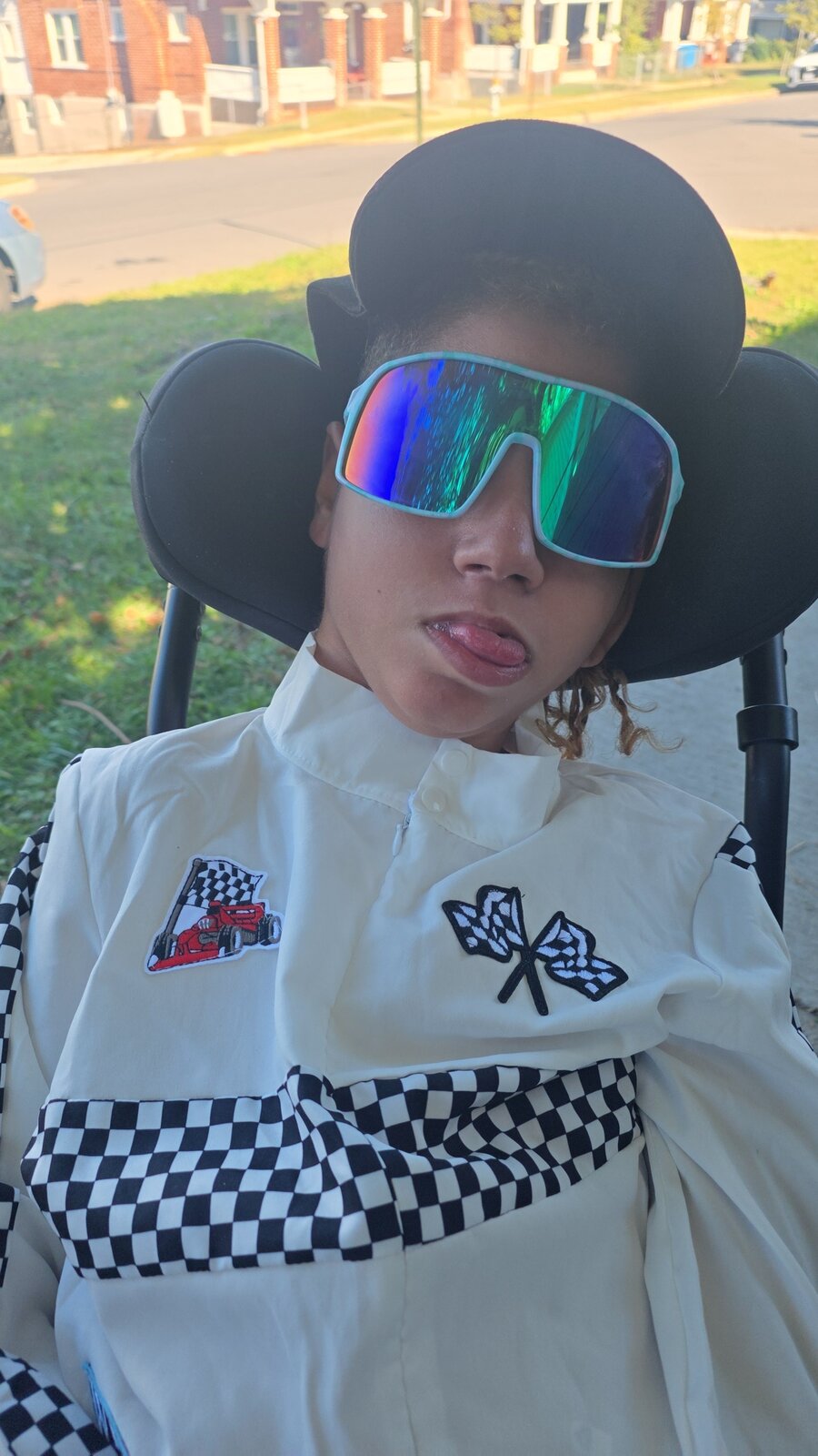 Child in a Number 55 costume on wheels